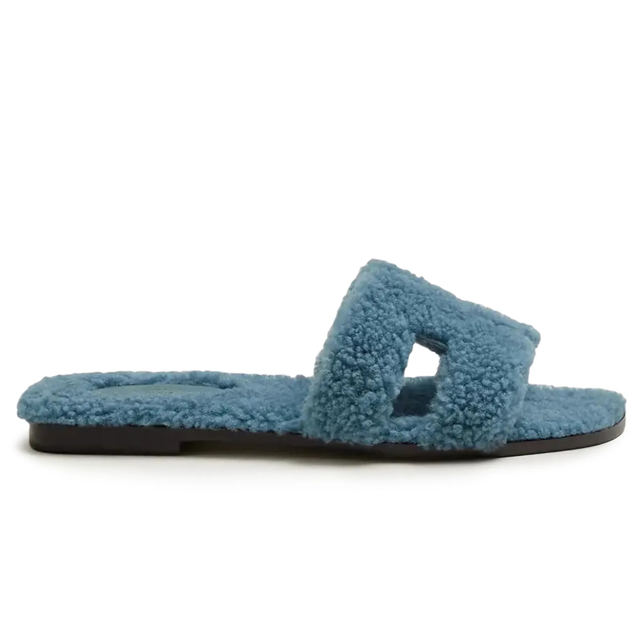 Side view of Hermes Paris Oran Blue Shearling Sandals